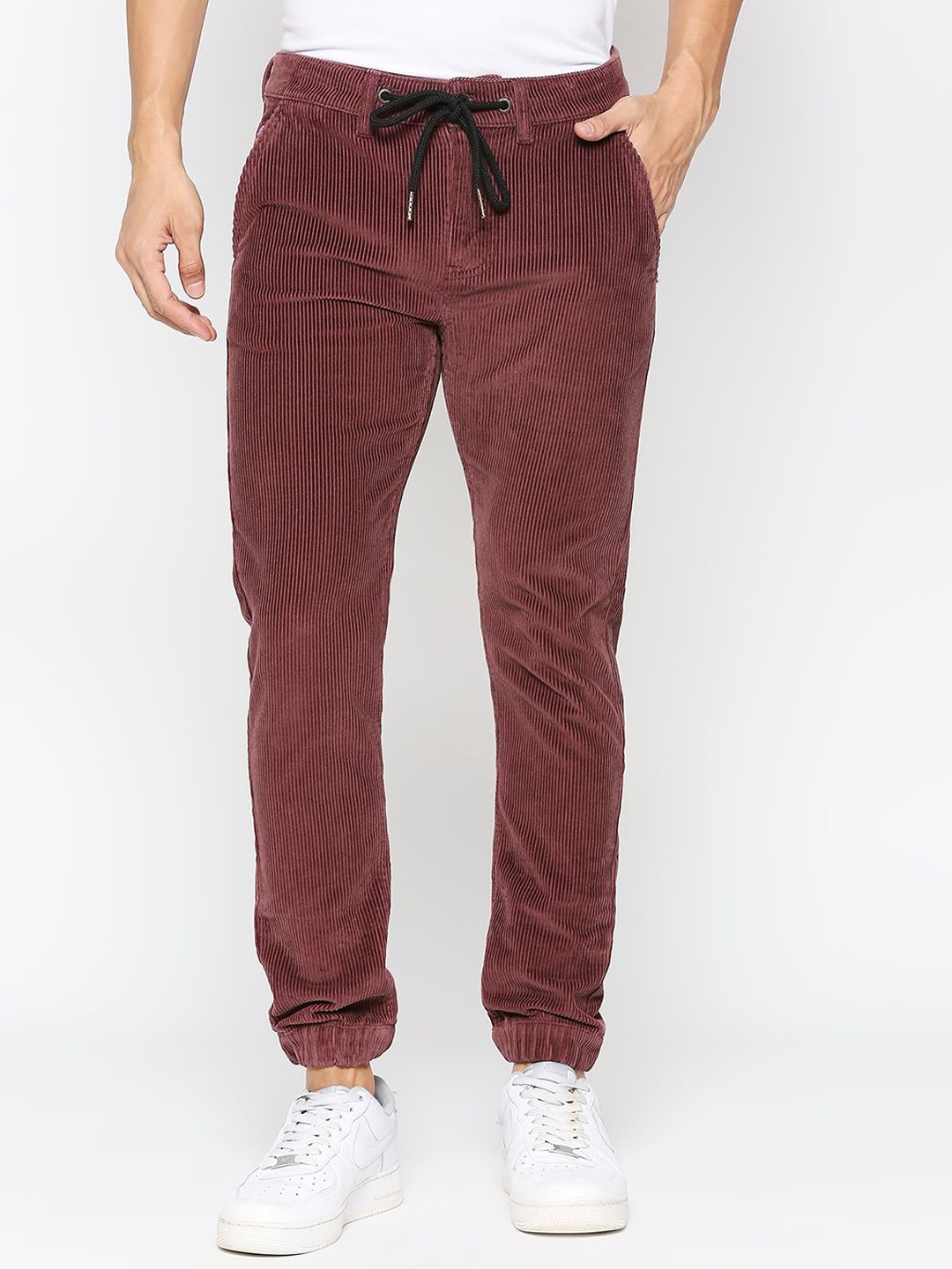 59275cb1-0c3d-4f93-a480-8300608acd231694681773804BeingHumanMenRedJoggerJeans1.jpg Men Striped Mid Rise Jogger - Image 1